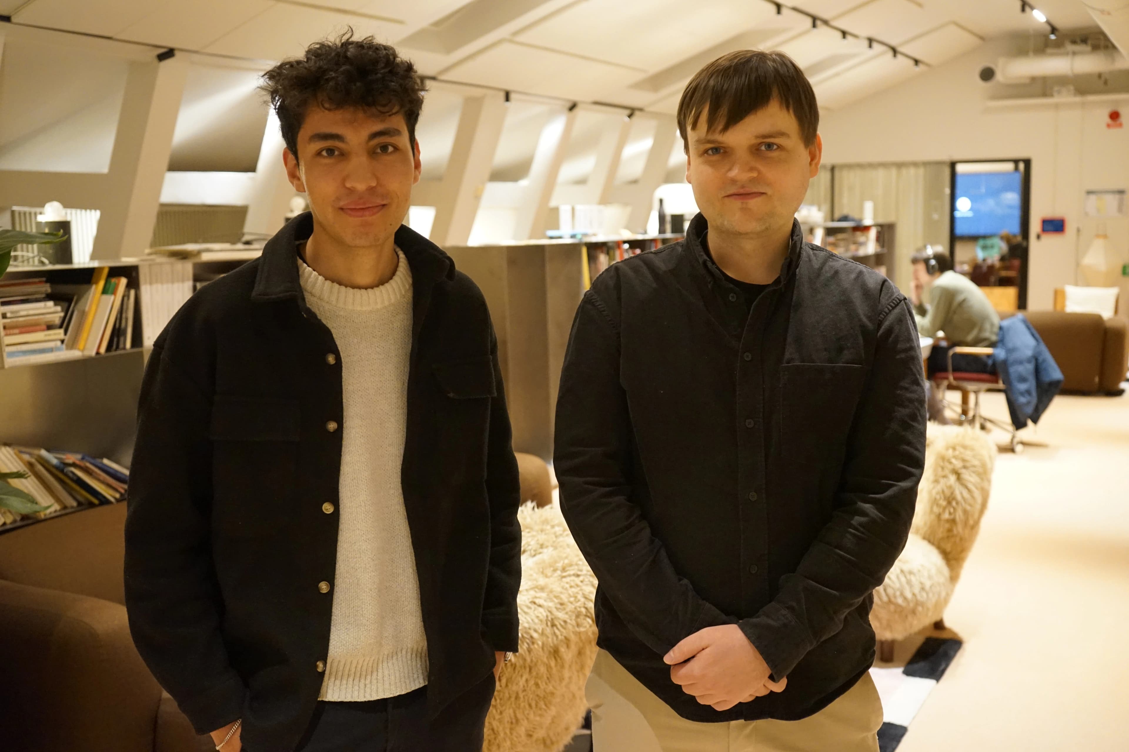 The two founders of Pango, an e-commerce logistics operating system, standing together in their office workspace.